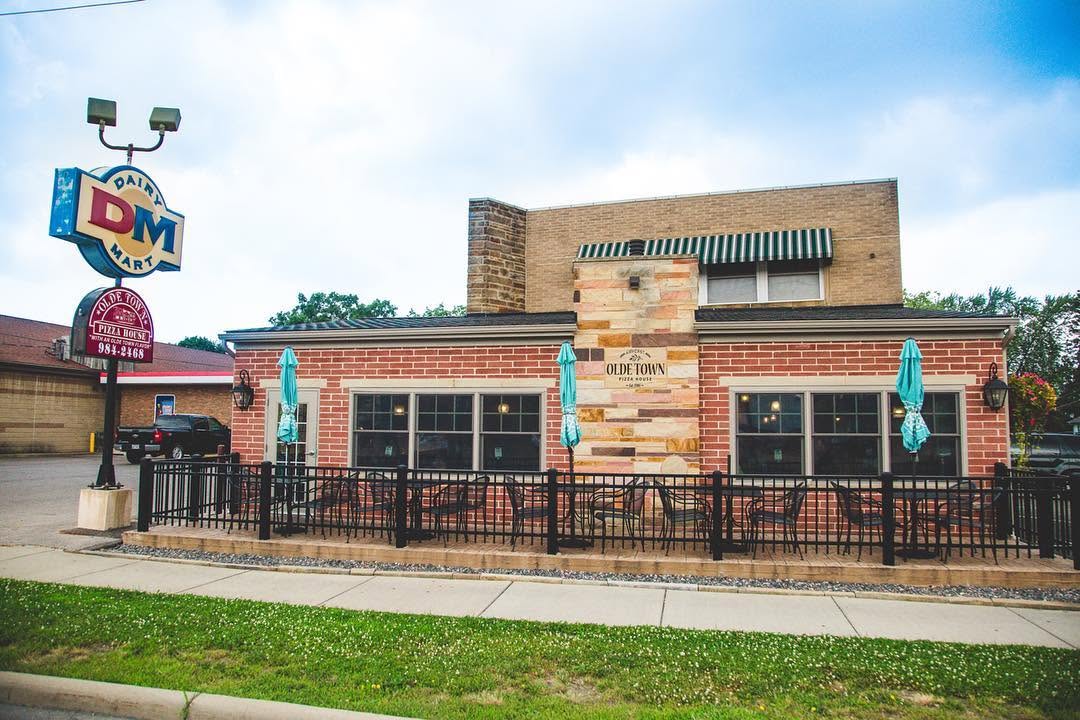Olde Town Pizza House patio and storefront on a bright afternoon — Amherst, Ohio