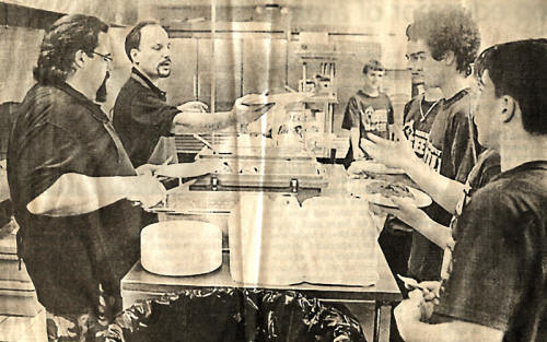 Olde Town Pizza House serving a spaghetti dinner fundraiser for Steele High School's hockey team