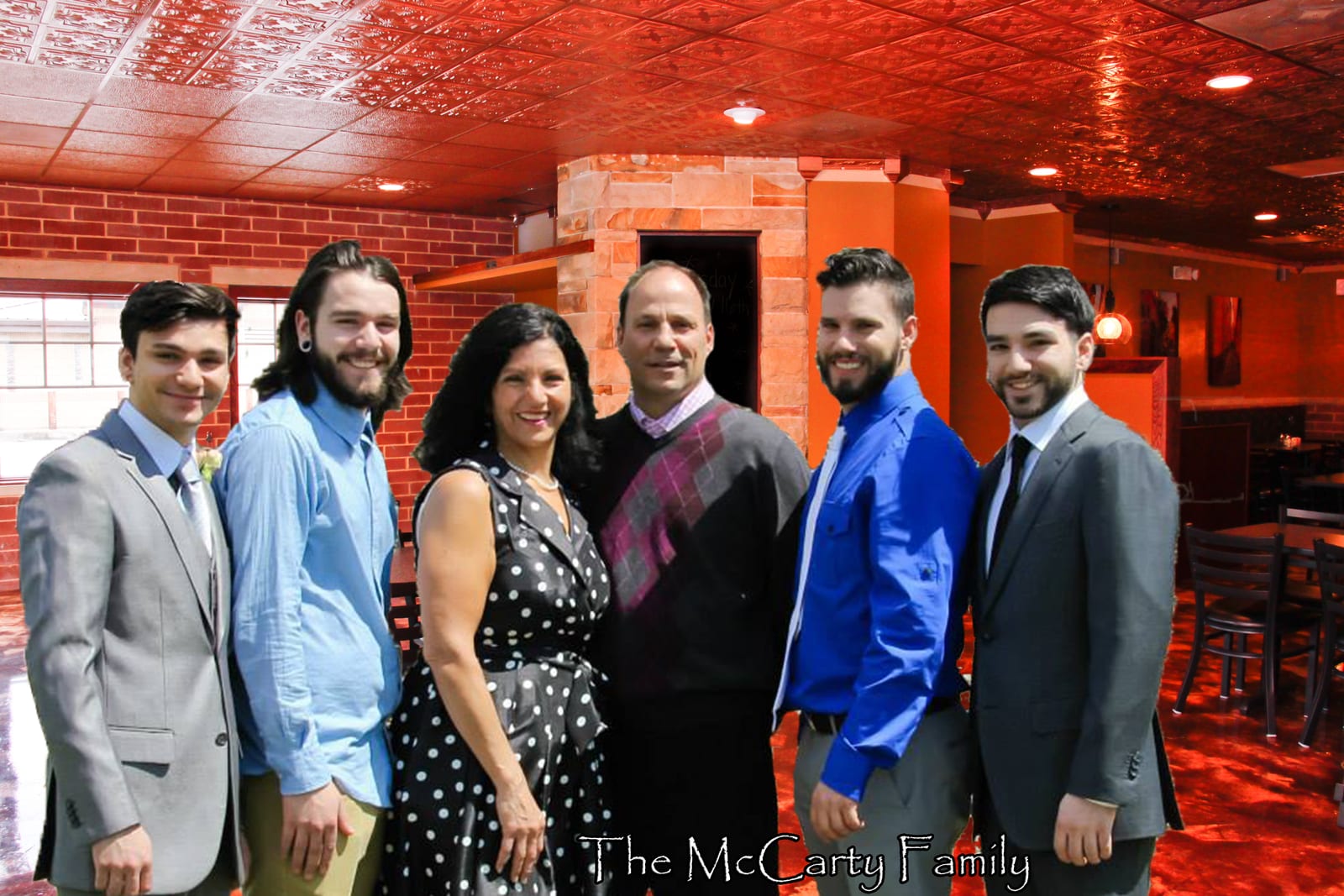 The McCarty family — Darrell, Denise, and their four sons — together at the restaurant
